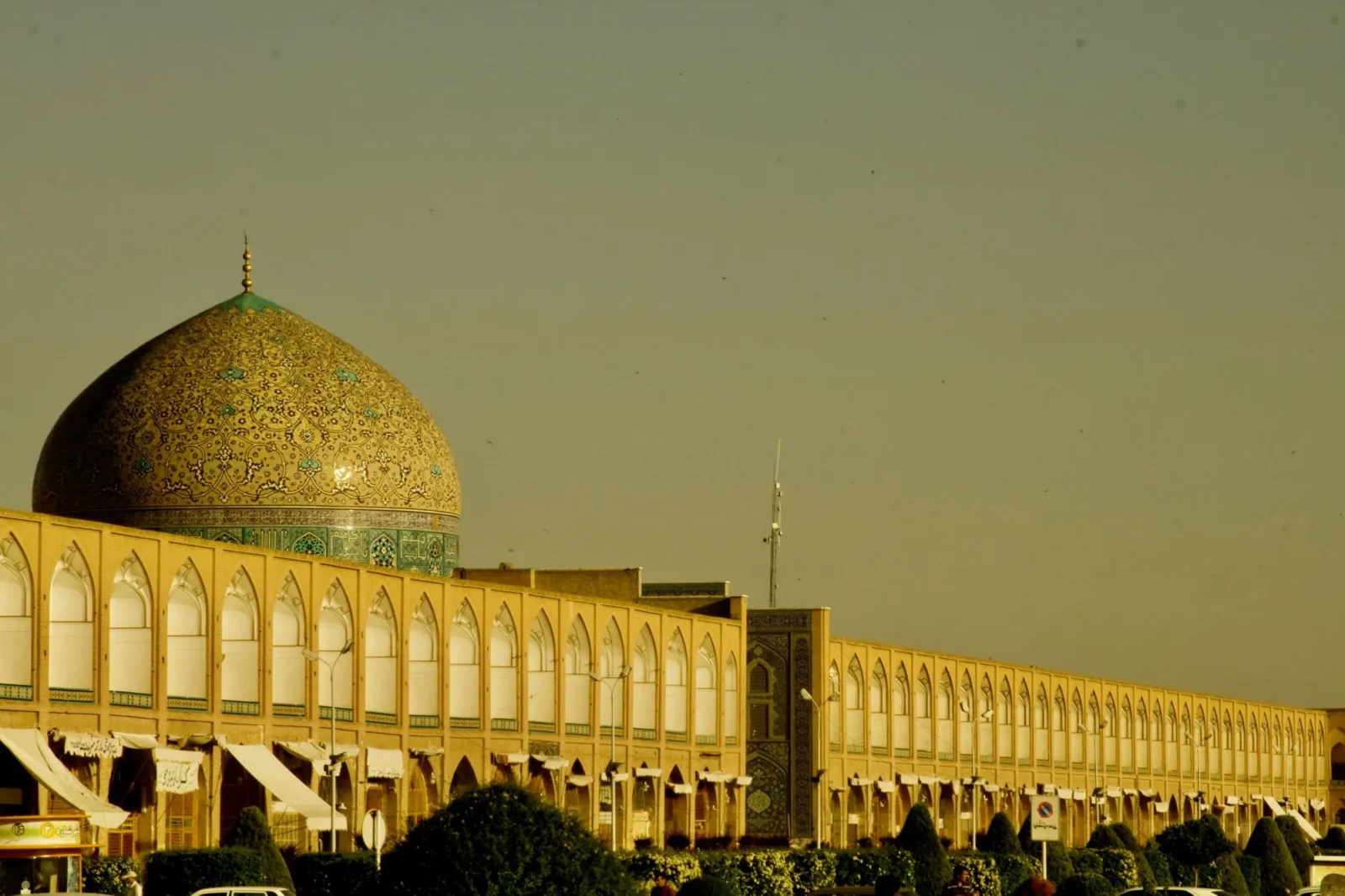 Naqsh-e Jahan arcade and dome, golden hour.