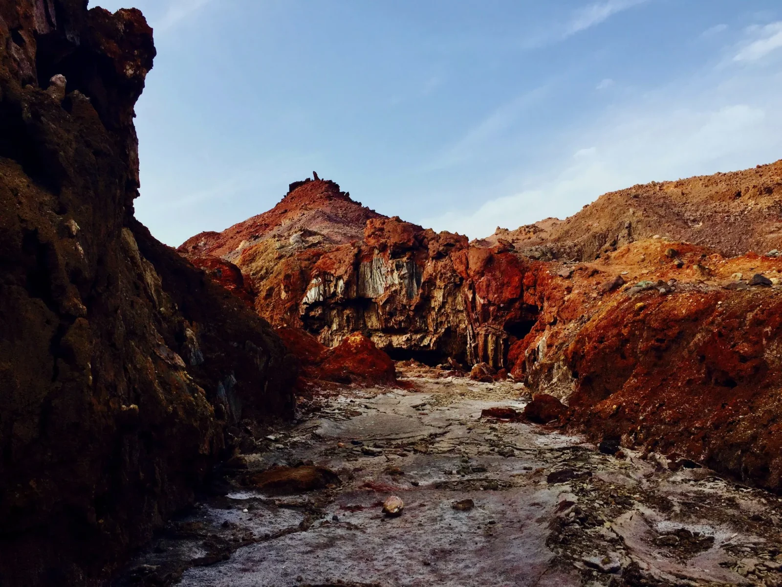 A red canyon with the wash running out of it.