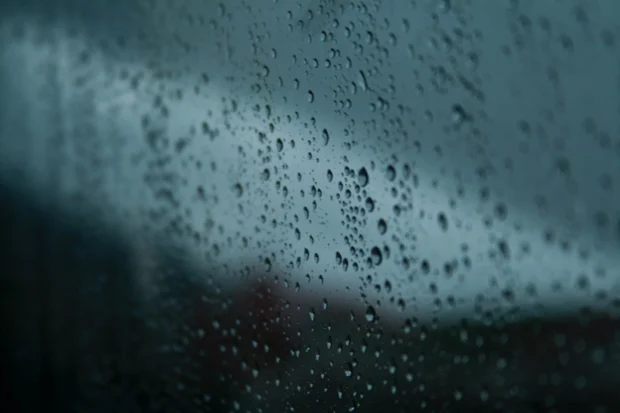 Rain on glass with the world going soft behind it.